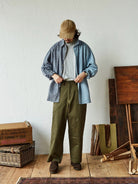 USAGE Hand Distressed Patched Chinos in Olive - On Male Model