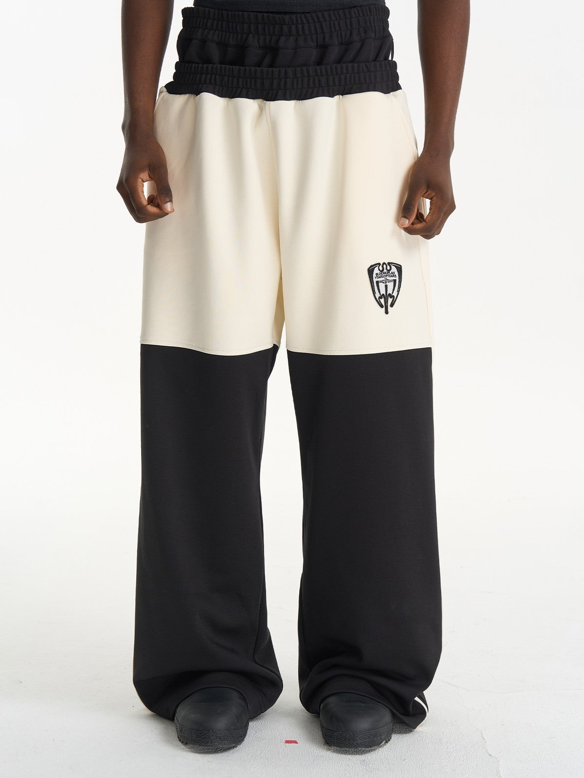 BLINDNOPLAN Color Block Wide Leg Sweatpants in Black - On Male Model