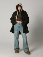 MASONPRINCE High Waisted Distressed Flared Jeans in Denim - On Female Model