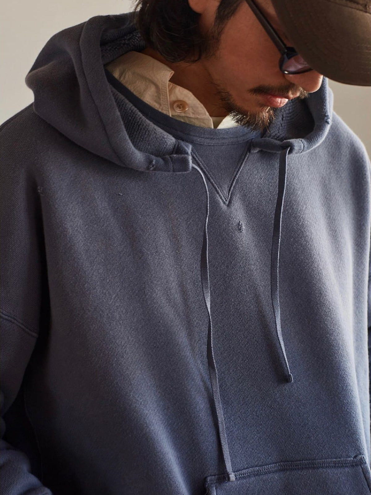 USAGE Faded Vintage Wash Hoodie in Blue - On Male Model