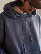 USAGE Faded Vintage Wash Hoodie in Blue - On Male Model