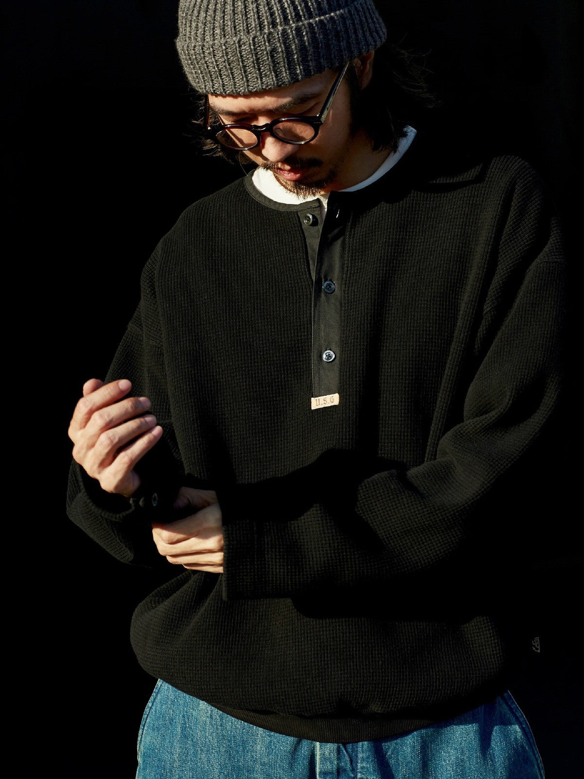 USAGE Heavyweight Waffle Knit Henley Sweatshirt in Black - On Male Model