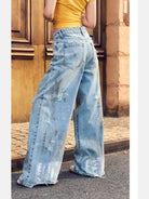 BeerBro Distressed Dirty Wash Relaxed Jeans in Blue - On Female Model