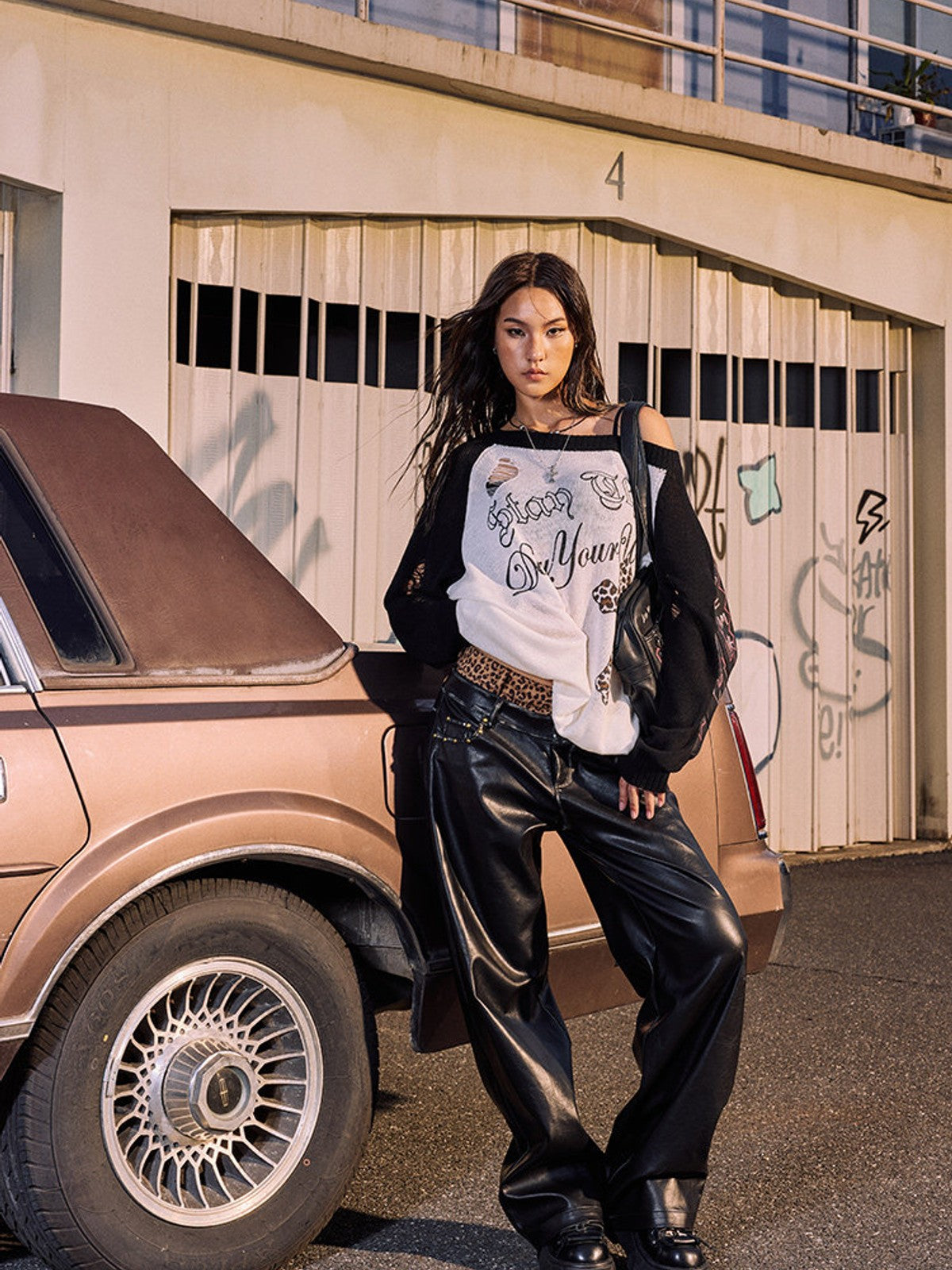 BEERBRO Distressed Graphic Off Shoulder Sweater in Black - On Female Model
