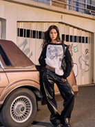 BEERBRO Distressed Graphic Off Shoulder Sweater in Black - On Female Model