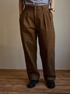 USAGE Pleated Cotton Twill Chinos in Beige - On Model