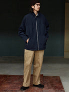USAGE Drawstring Zip Front Tech Anorak in Navy Blue - On Male Model