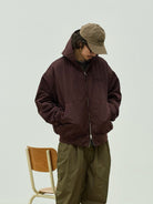 USAGE Crinkle Nylon Hooded Track Jacket in Brown - On Male Model