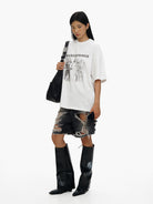 MASONPRINCE Washed Distressed Denim Shorts in Gray - On Female Model