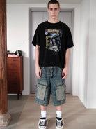 UNKNOWNWORLD Mud Dyed Multi Pocket Denim Shorts in Blue - On Male Model