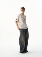 BLINDNOPLAN Wax Print Unicorn Graphic T Shirt in Beige - On Female Model