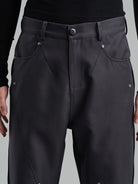 BLINDNOPLAN Diagonal Paneled Trousers with Rivets in Gray - On Male Model
