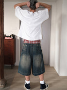 UNKNOWNWORLD Mud Dye Reverse Pocket Shorts in Yellow - On Model