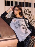 BEERBRO Distressed Graphic Off Shoulder Sweater in Black - On Female Model