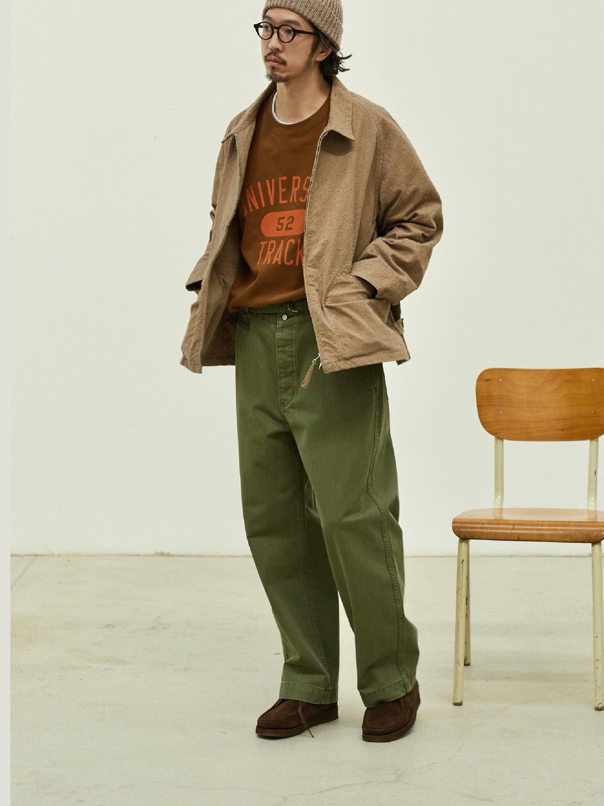 USAGE Heavyweight Herringbone Twill Belted Trousers in Olive - On Male Model