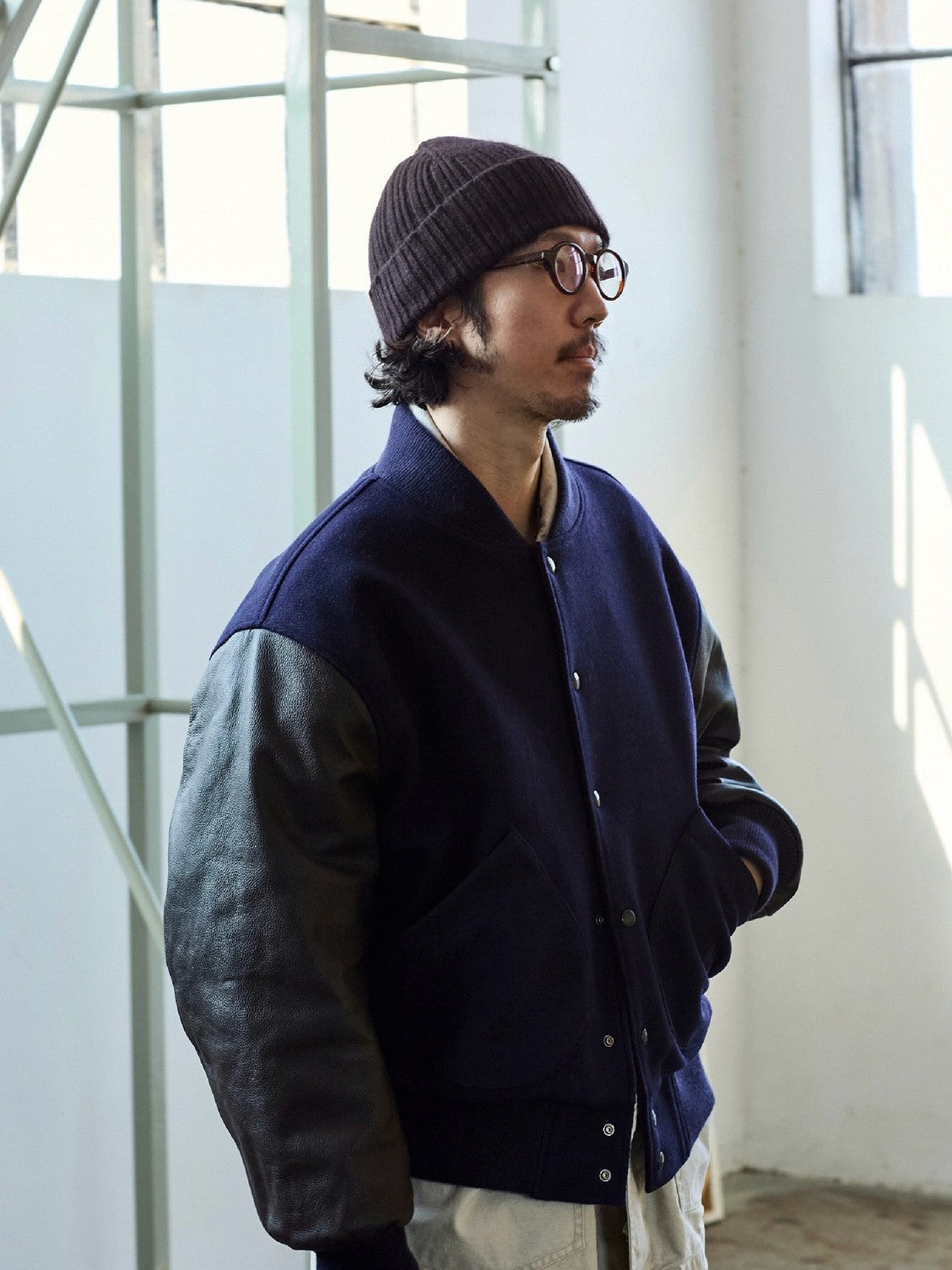 USAGE Reversible Velvet Leather Varsity Jacket in Navy Blue - On Male Model