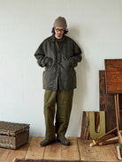 USAGE Hand Distressed Patched Chinos in Olive - On Male Model