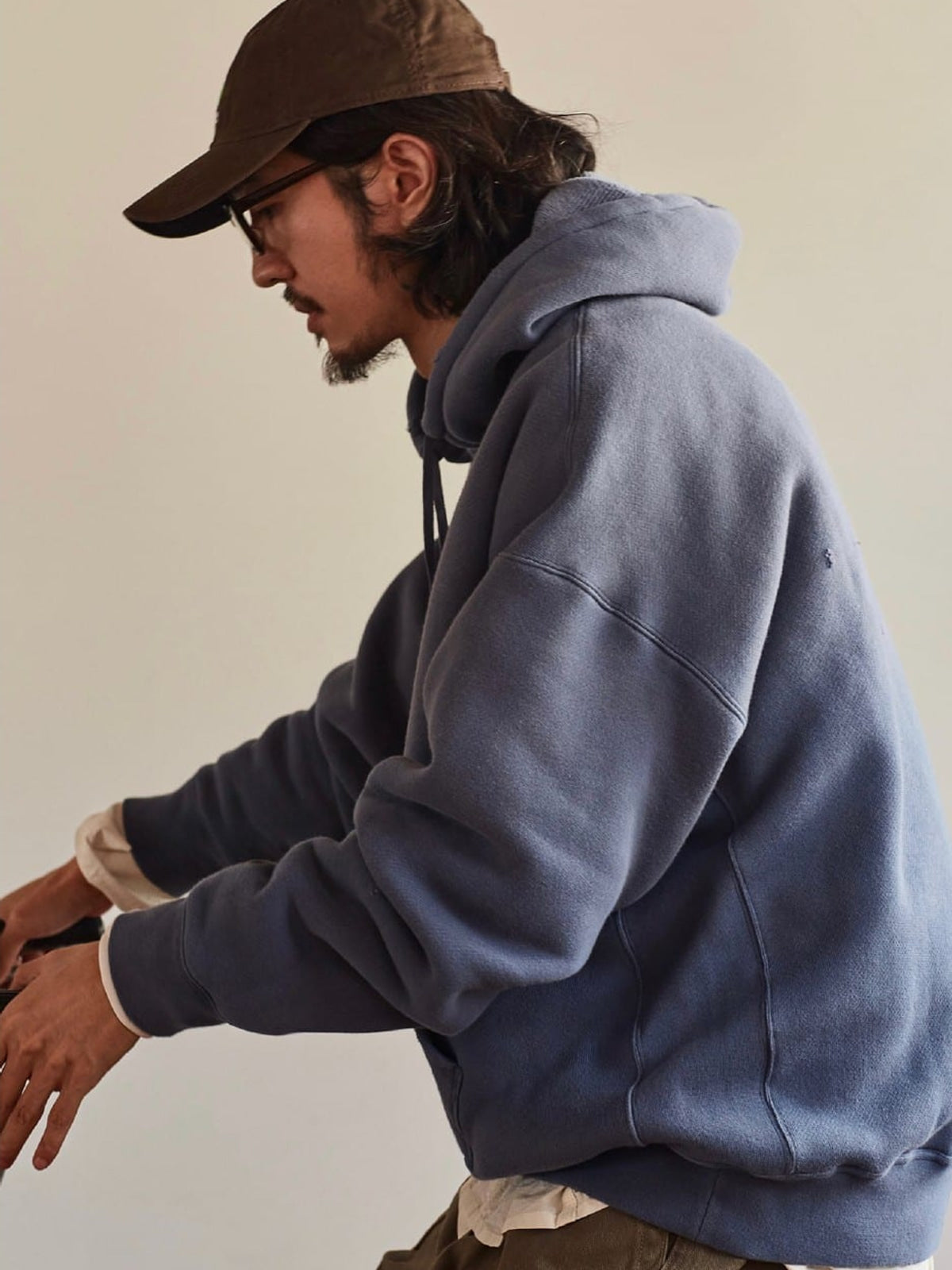 USAGE Faded Vintage Wash Hoodie in Blue - On Male Model