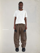 UNKNOWNWORLD Distressed Cotton Henley T Shirt in White - On Female Model