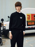 SOD Embroidered Mock Neck Top in Black - On Male Model