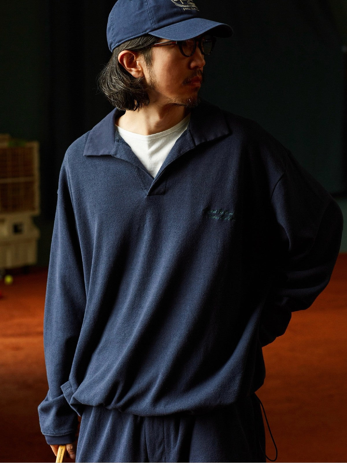 USAGE Oversized Textured Long Sleeve Polo in Navy Blue - On Male Model