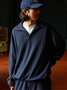 USAGE Oversized Textured Long Sleeve Polo in Navy Blue - On Male Model