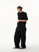 BLINDNOPLAN Layered Cotton Blend Sweatpants in Black - On Female Model