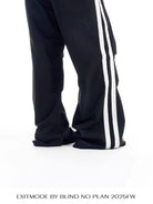 BLINDNOPLAN Striped Pleated Track Pants in Black - On Model