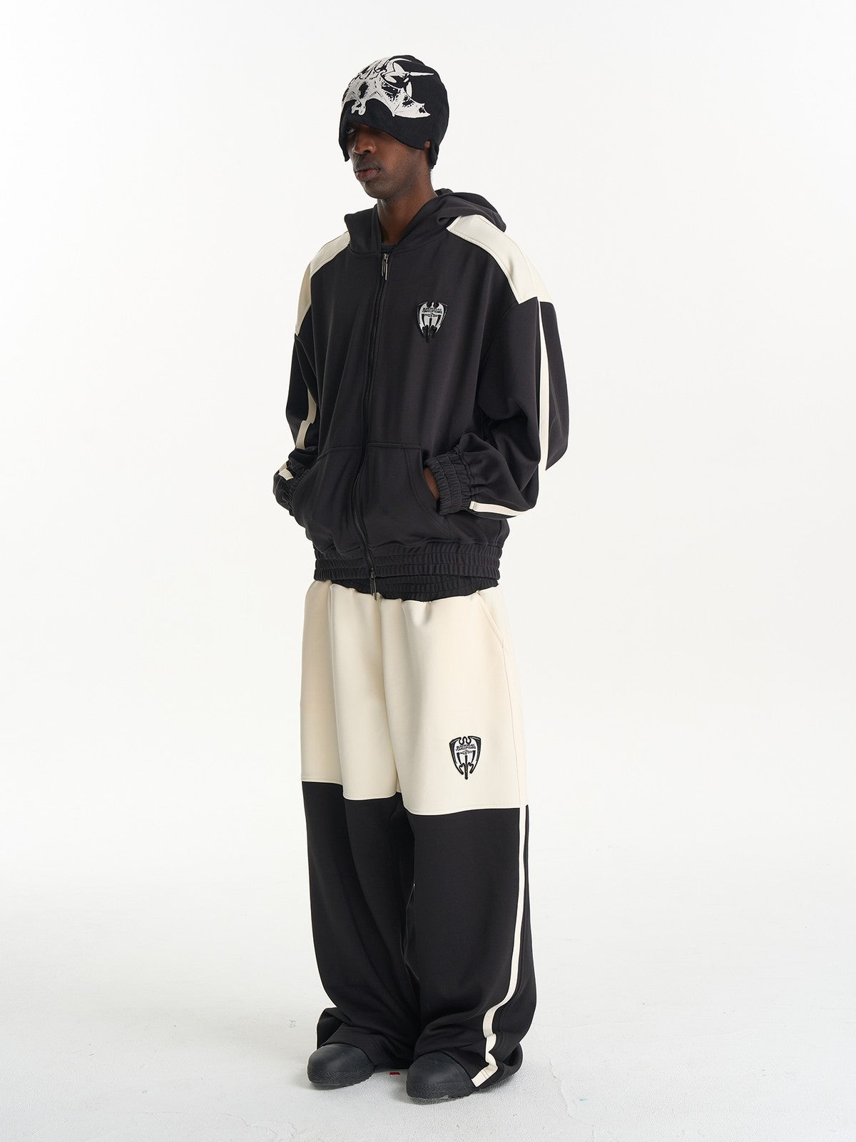 BLINDNOPLAN Hooded Colorblock Track Jacket in Black - On Male Model