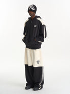 BLINDNOPLAN Hooded Colorblock Track Jacket in Black - On Male Model
