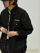 USAGE Oversized Micro Check Button Down Shirt in Black - On Male Model