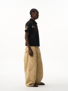 BLINDNOPLAN Distressed Embroidered Cotton Polo in Black - On Male Model