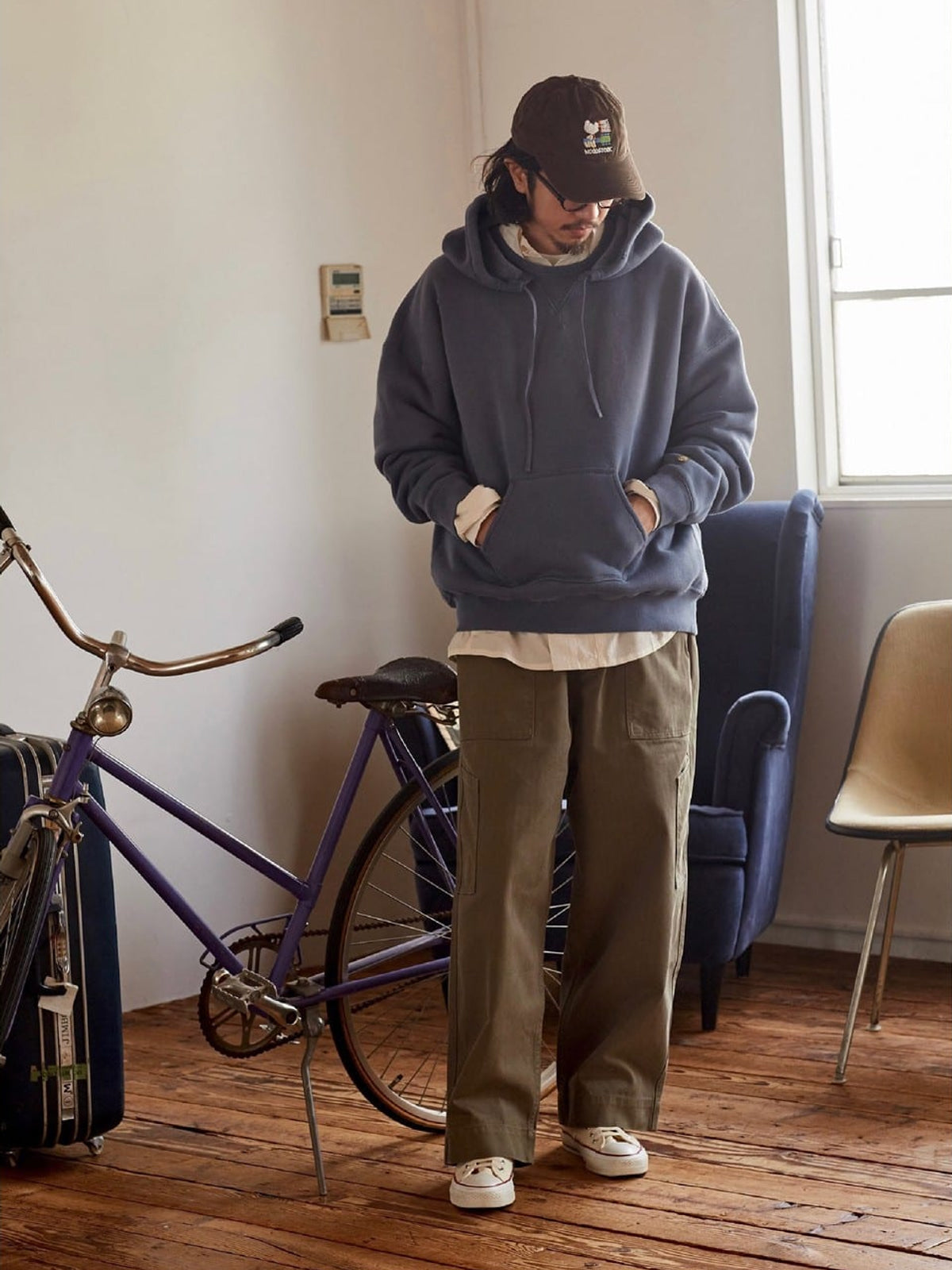 USAGE Faded Vintage Wash Hoodie in Blue - On Male Model