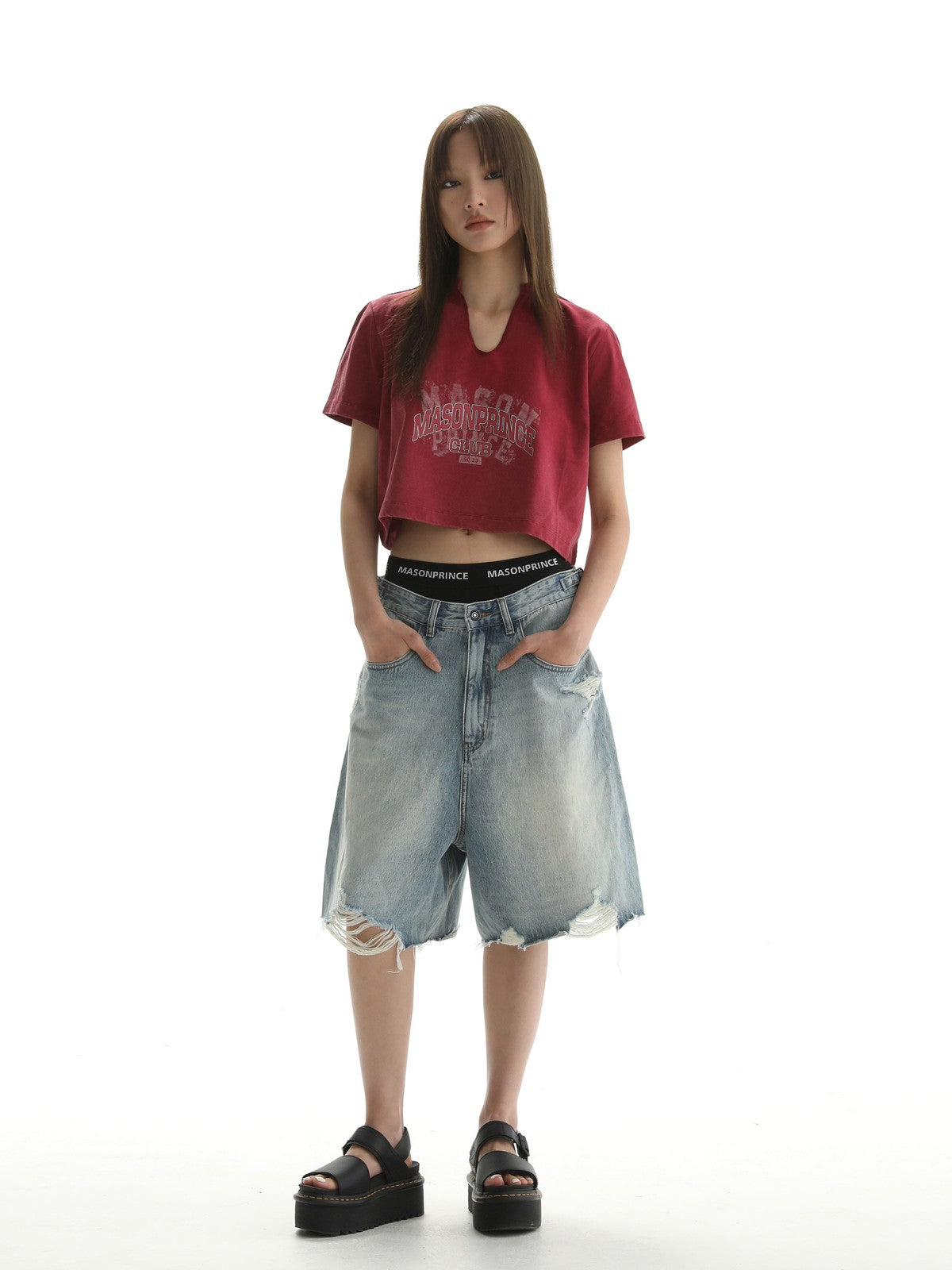 MASONPRINCE Light Wash Raw Hem Denim Shorts in Blue - On Female Model