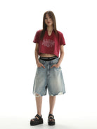 MASONPRINCE Light Wash Raw Hem Denim Shorts in Blue - On Female Model