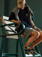 USAGE Retro Tennis Graphic Cotton T Shirt in Navy Blue - On Male Model