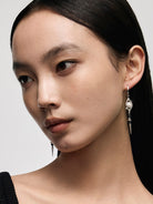 BLACKHEAD Pearl Eye Spike Drop Earrings in Silver - On Female Model