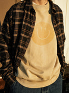 USAGE Washed Cotton Raglan Smiley Sweatshirt in Beige - On Male Model