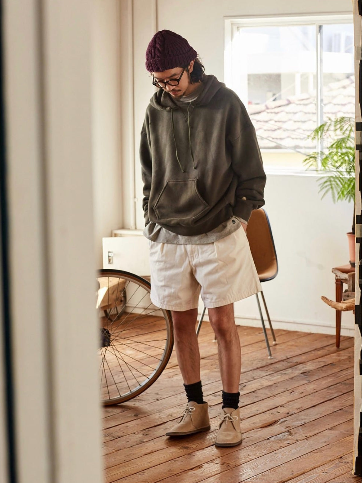 USAGE Faded Vintage Wash Hoodie in Olive - On Male Model