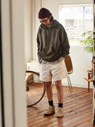 USAGE Faded Vintage Wash Hoodie in Olive - On Male Model