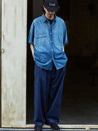 USAGE Distressed Short Sleeve Denim Shirt in Denim - On Male Model