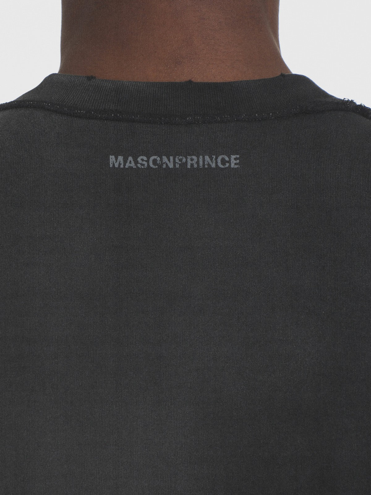 MASONPRINCE Distressed Typographic Cotton T Shirt in Black - On Model