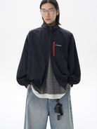MASONPRINCE Lightweight Tonal Check Nylon Jacket in Navy Blue - On Male Model