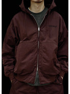 USAGE Crinkle Nylon Hooded Track Jacket in Brown - On Male Model