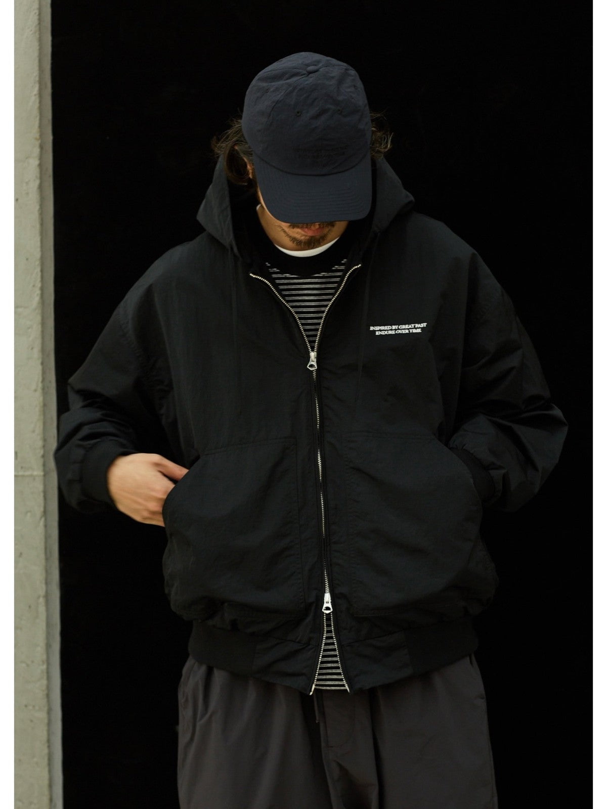 USAGE Crinkle Nylon Hooded Track Jacket in Black - On Male Model