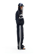 BLINDNOPLAN Striped Pleated Track Pants in Black - On Male Model