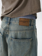 MASONPRINCE Frayed Hem Slub Denim Pants in Light Blue - On Model