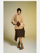 BeerBro Distressed Fuzzy Argyle Sweater in Beige - On Female Model