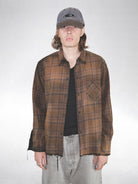 UNKNOWNWORLD Distressed Raw Hem Plaid Shirt in Brown - On Male Model