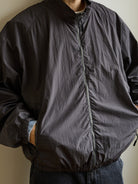 USAGE Lightweight Nylon Zip Up Jacket in Gray - On Male Model